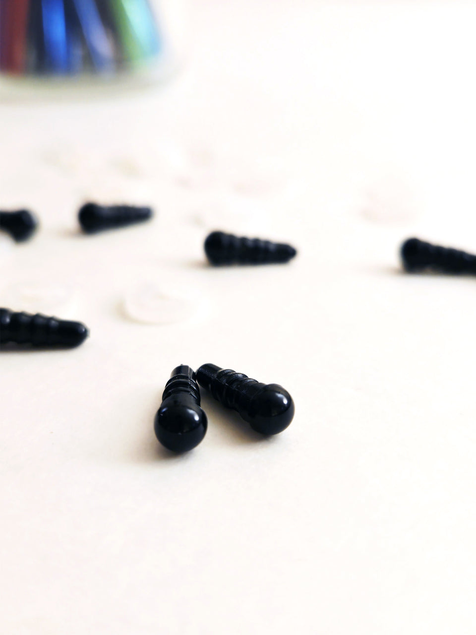 closeup of 4.5 mm black plastic safety eyes