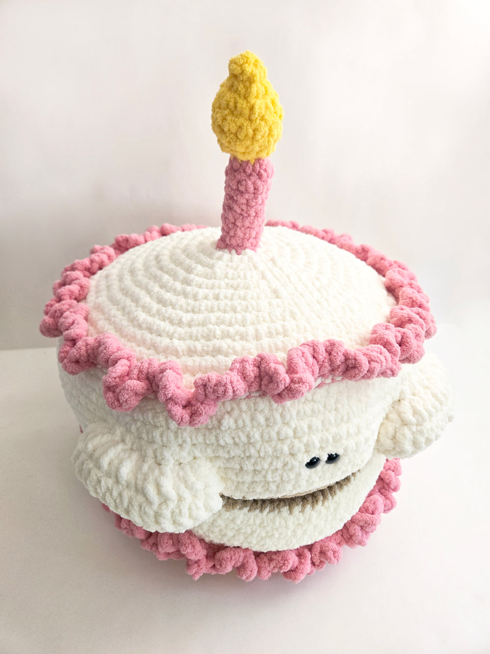 Pink and white crochet cake
