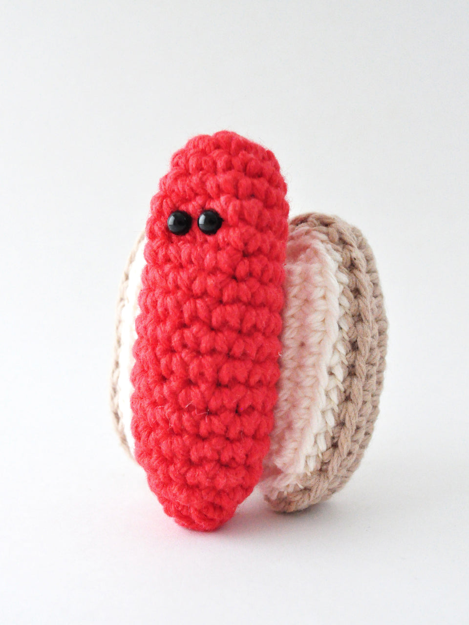 Three quarter view of hot dog amigurumi in front of white background, crochet pattern by The Pudgy Rabbit