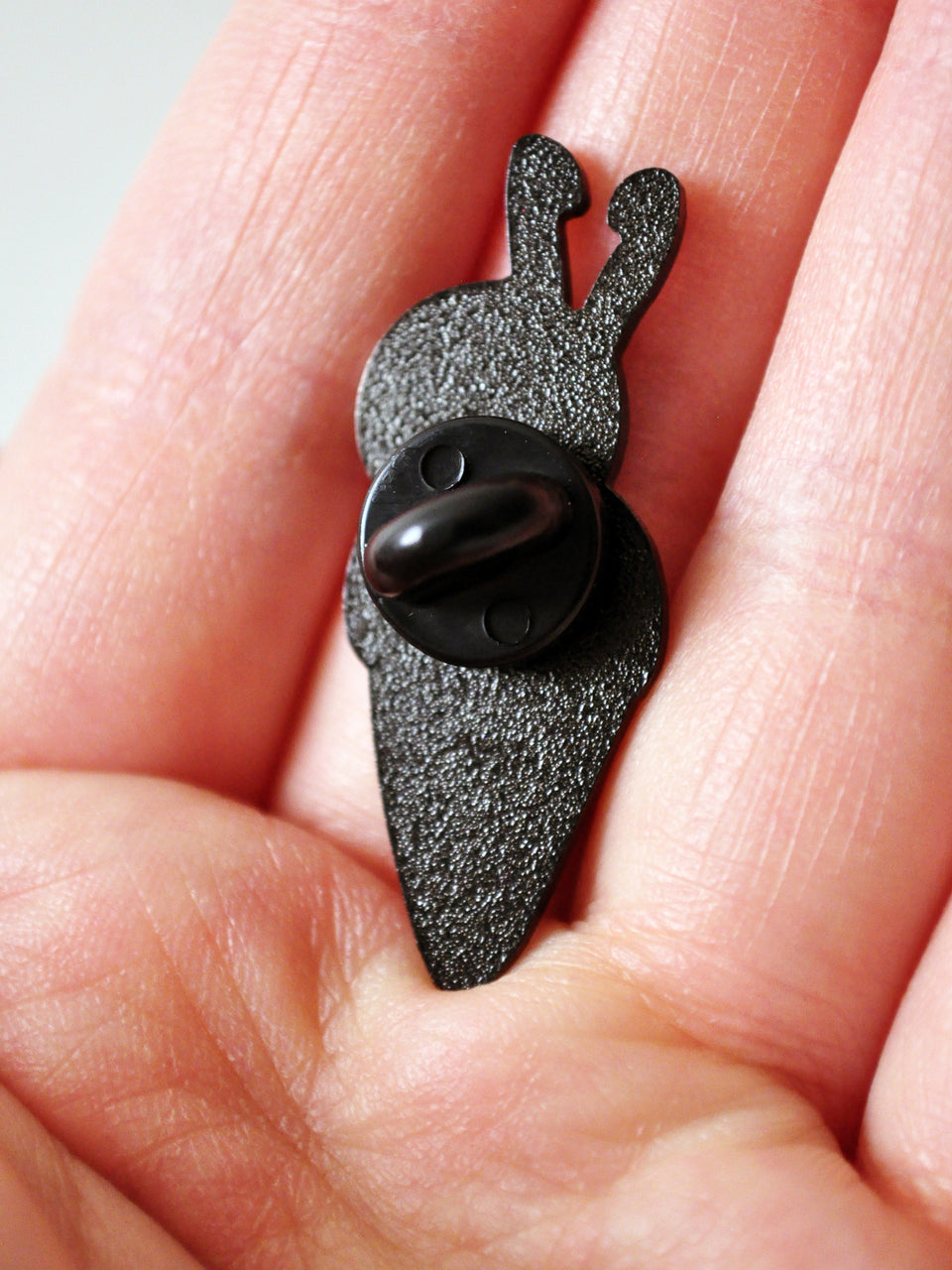 back of crochet enamel pin