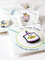 enamel pins by the pudgy rabbit
