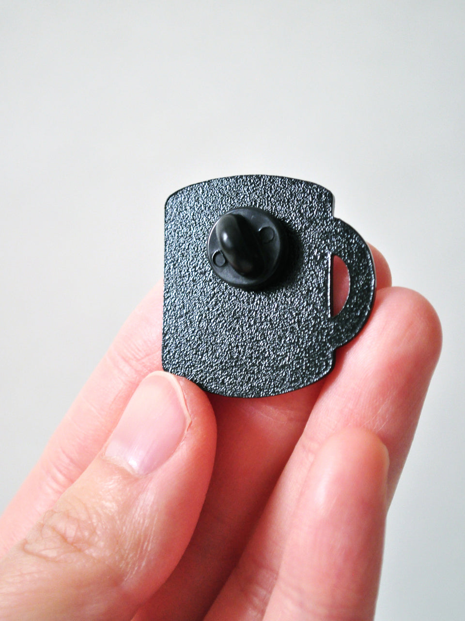 back of coffee mug enamel pin